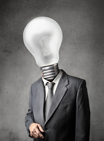 Businessman with a light bulb instead of his headの写真素材