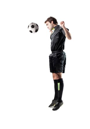 Isolated soccer player hitting headshooting a footballの写真素材