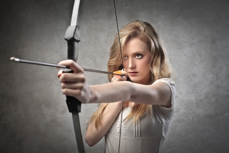 Beautiful young woman drawing a bowの写真素材