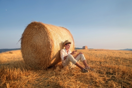 Texting a Message in the Countrysideの写真素材