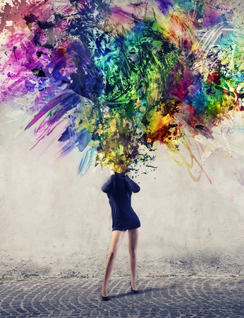 Woman allowing to escape from his neck a multitude of colorful paintsの写真素材