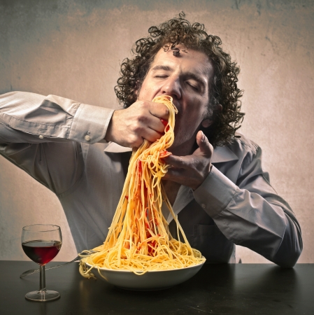Man gorging of spaghettiの写真素材