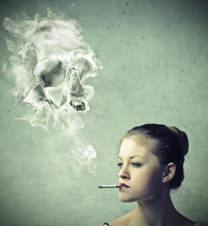 Girl smoking a cigaretteの写真素材