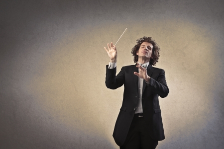 Man conducting an orchestraの写真素材