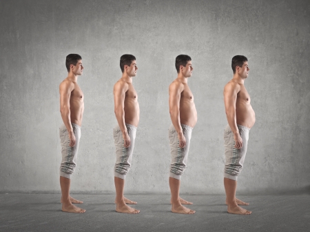 evolution nice skinny guy with a fat bellyの写真素材