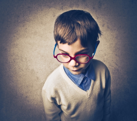 child portrait with red glassesの写真素材