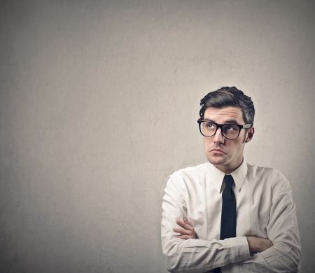 pensive businessman looking upの写真素材
