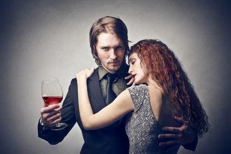 handsome young man conquest beautiful red womanの写真素材