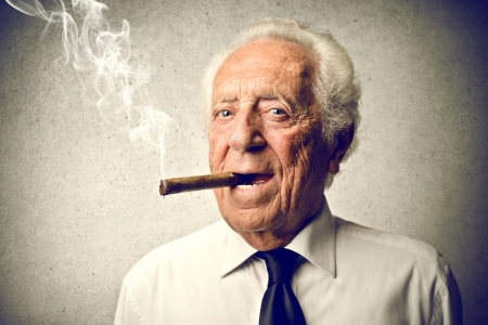 old man smoking a cigar