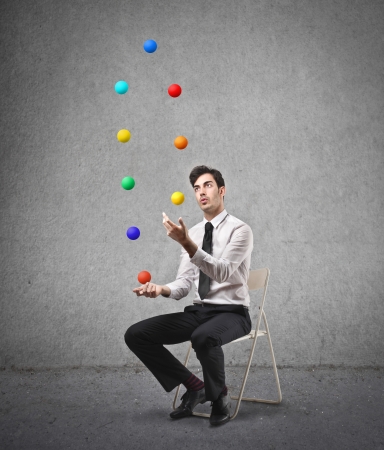 businessman feeling like a jugglerの写真素材