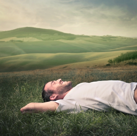 man relaxing on the grass