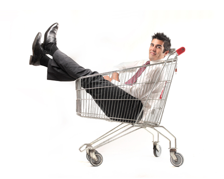businessman relaxing into a cartの写真素材