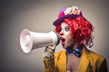 clown speaking through a megaphoneの写真素材