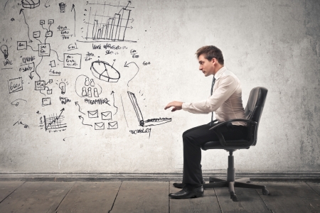 businessman working on a drawn computerの写真素材