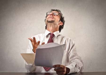 businessman holding some documentsの写真素材
