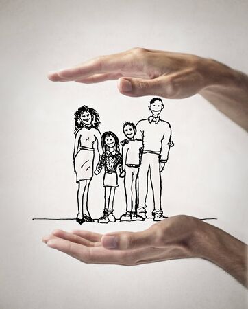 drawn family between two handsの写真素材