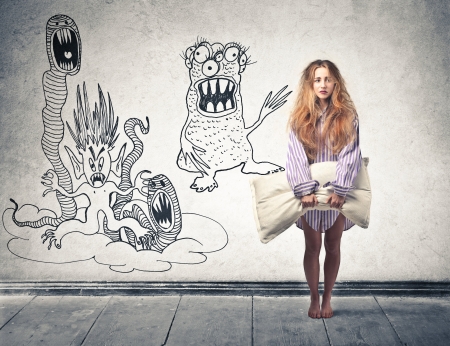 young woman having nightmares の写真素材