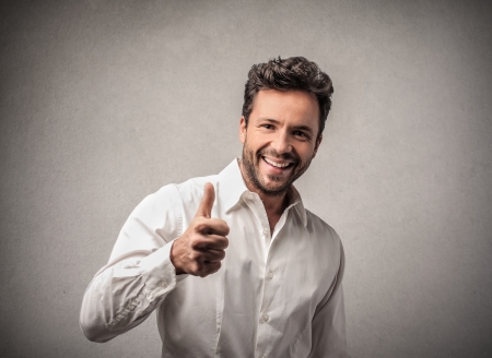 man smiling with thumb upの写真素材