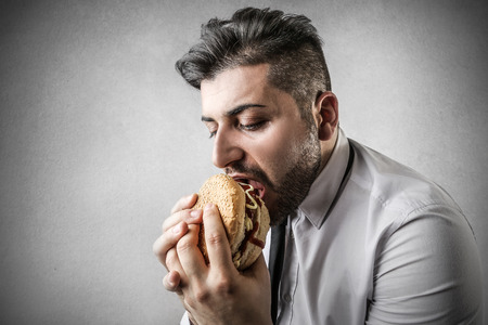 businessman with sandwichの写真素材
