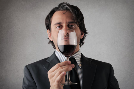 businessman with wineの写真素材