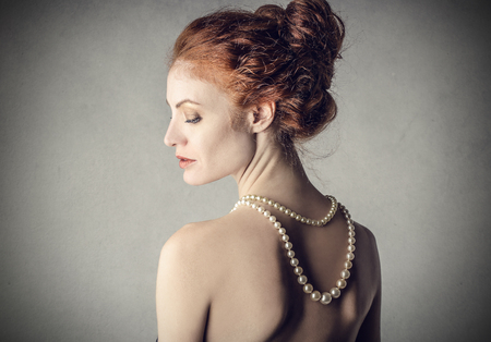 Classy woman wearing a pearl necklaceの写真素材