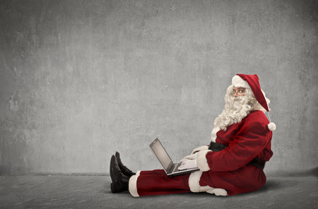 Santa uses technologyの写真素材