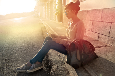 Sitting on the ground in a sunny dayの写真素材