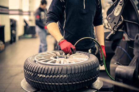 Mechanic checking air pressure