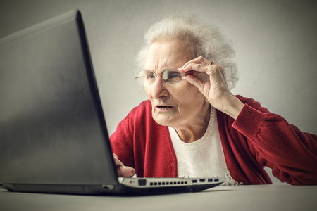 Elderly woman surfing the Netの写真素材