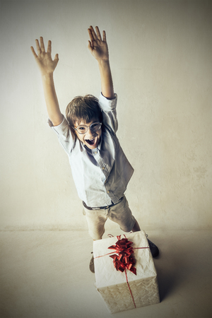 Happy kid with a presentの写真素材