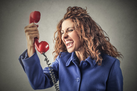 Screaming into the phoneの写真素材