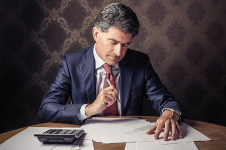 Businessman signing papersの写真素材