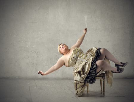 Chubby woman falling downの写真素材
