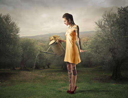 Mother Nature watering a gardenの写真素材