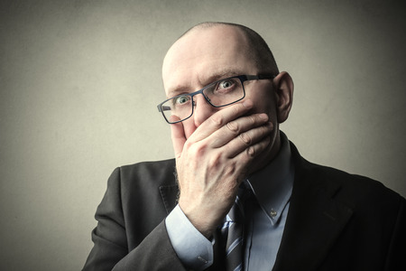 Businessman regretting somethingの写真素材