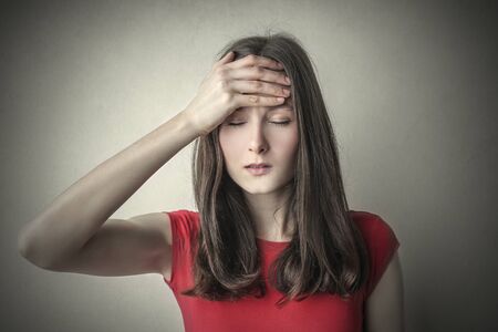 Girl suffering from headacheの写真素材