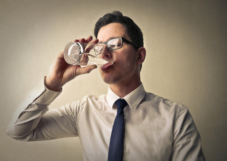 Businessman drinking a glass of water