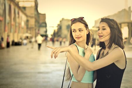 Two girls looking at somethingの写真素材