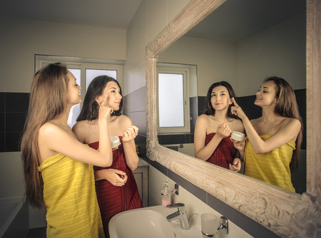 Two girls in the bathroomの写真素材