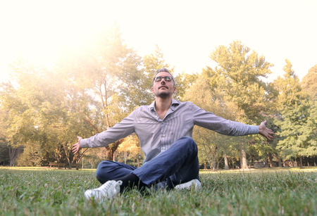 Businessman relaxing in the parkの写真素材