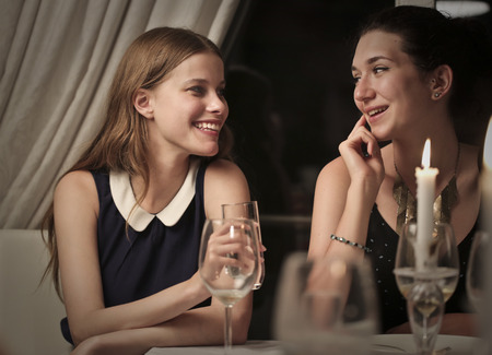 Friends chatting at dinnerの写真素材