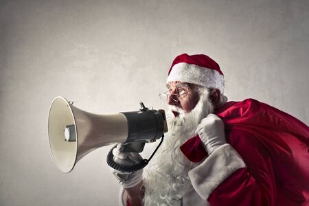 Santa Claus shouting into a megaphoneの写真素材
