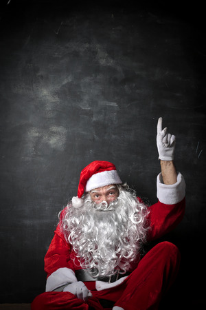 Santa Claus pointing upwardsの写真素材