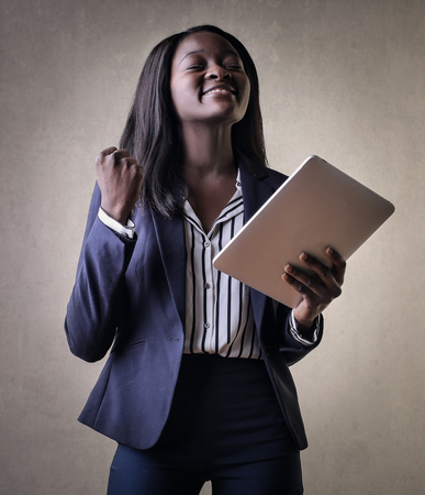 Successful Business woman holding a tabletの写真素材