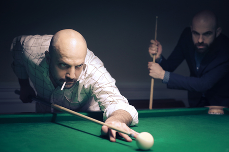 Men playing billiard