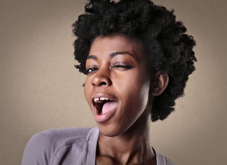 Cute girl posing for a funny pictureの写真素材