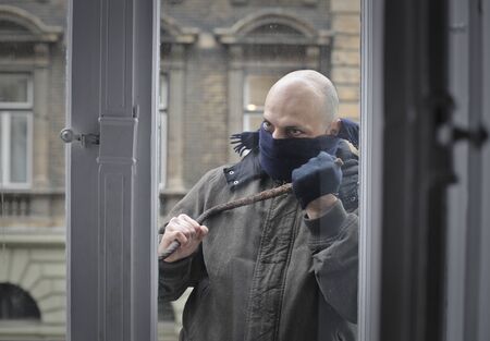 Burglar trying to break inの写真素材