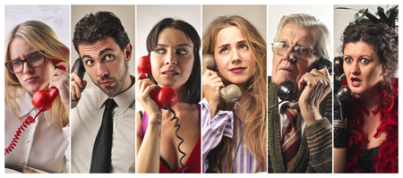 Different people speaking on the phoneの写真素材