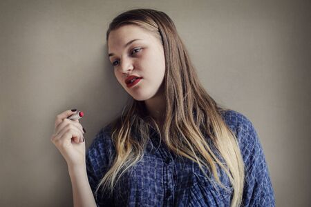 Blonde woman with red lipstickの写真素材