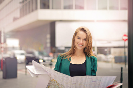 Tourist holding a mapの写真素材